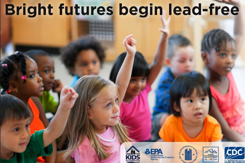 A group of children with a  saying - Bright futures begin lead-free.
